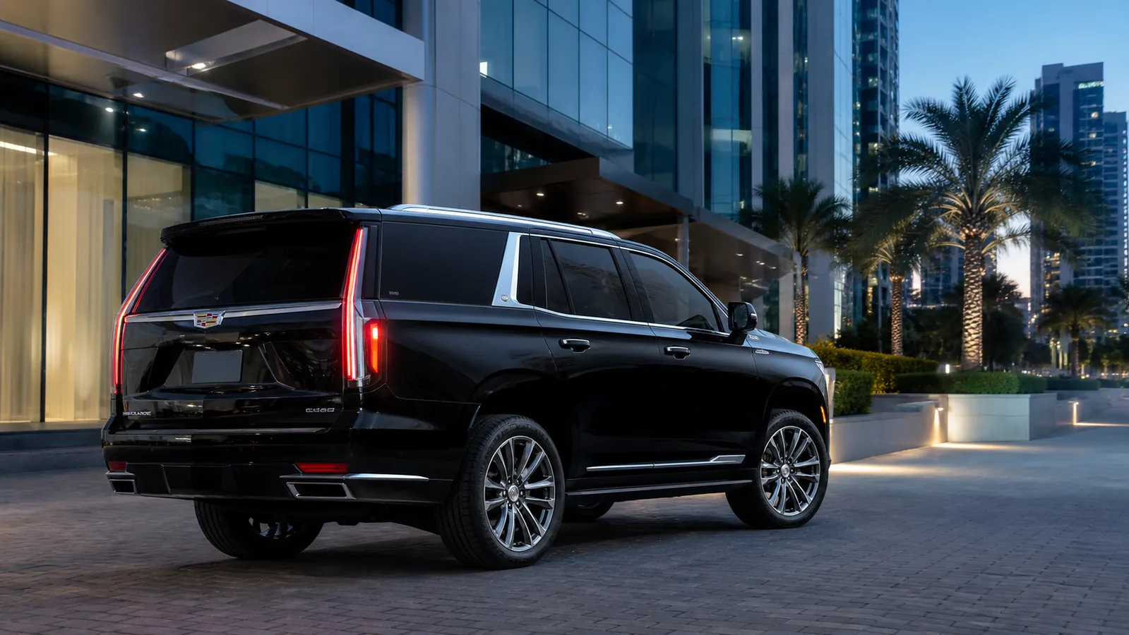 Black 2022 Cadillac Escalade waiting outside a modern Miami office