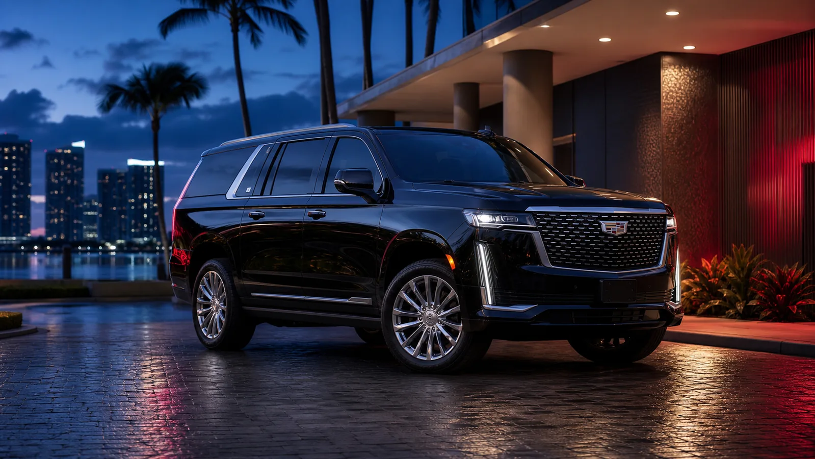 Black 2022 Cadillac Escalade Premium Luxury in an upscale Miami setting at evening
